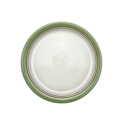 Image Description for  Dinner Plate (10") in Bud Green: A charming bud green dinner plate from Clinton Pottery's Handmade Dinnerware Collection. The 10-inch plate features a delightful green glaze, reminiscent of fresh spring foliage. Its ample size makes it an ideal choice for serving a delightful dinner with a touch of natural charm and vibrancy.