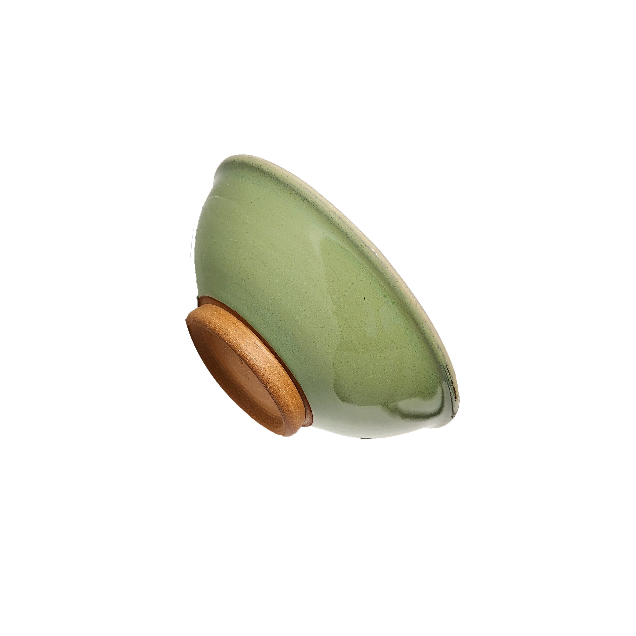 Image: A small mixing bowl in a delightful shade of bud green, offering a convenient capacity of 2.25 cups. Perfect for ingredients, snacks, or condiments, this bowl combines functionality with style for your kitchen needs.