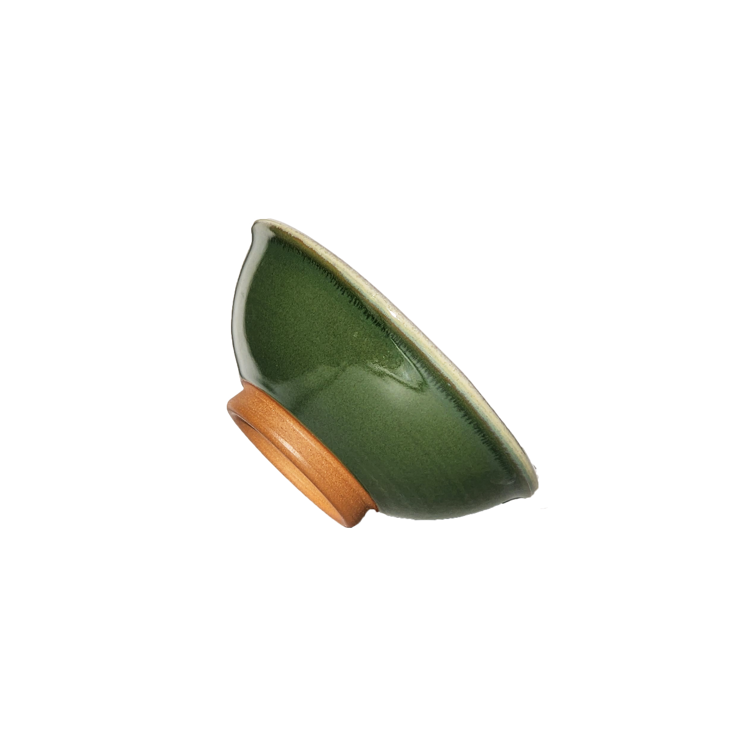 Image: A small mixing bowl in a rich dark green shade, offering a capacity of 2.25 cups. Perfect for ingredients, snacks, or condiments, this bowl brings a touch of elegance and nature-inspired charm to your kitchen.